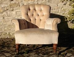 Howard and Sons button back antique antique armchair.jpg
